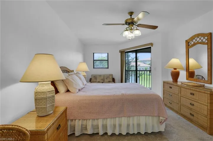 Bedroom featuring ceiling fan, access to outside, and carpet floors