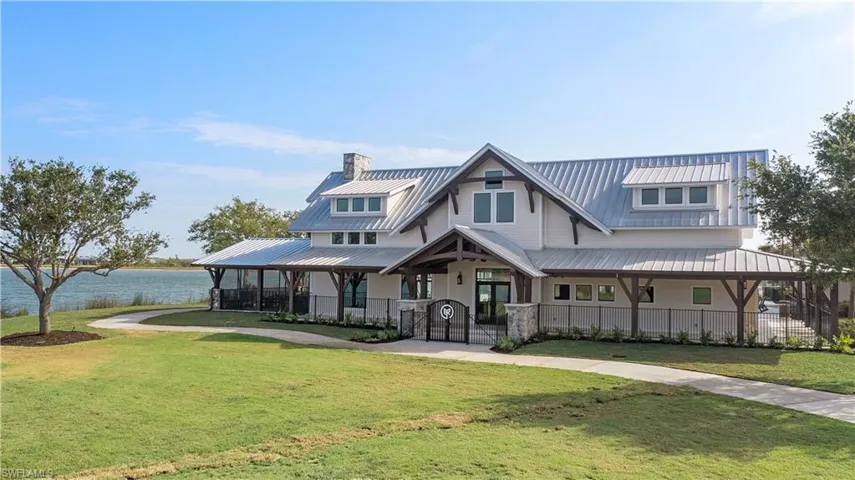 View of front of house featuring a water view and a front yard