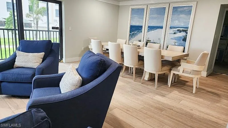 Community RM Dining room with light wood-style floors