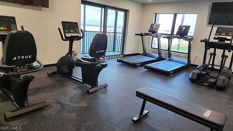 Community Exercise room featuring healthy amount of natural light