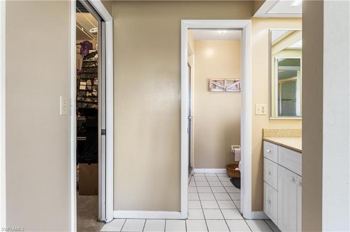 En-suite bathroom with huge walk-in closet on left.