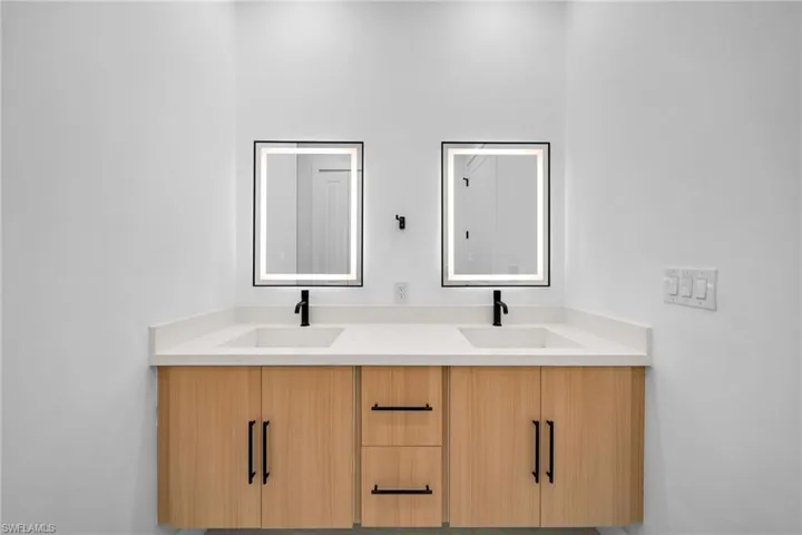 Bathroom featuring double vanity
