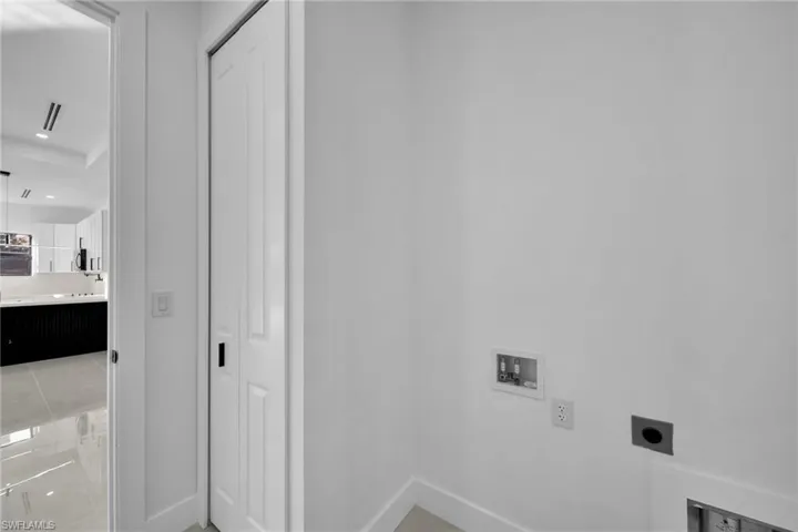 Laundry room with washer hookup and hookup for an electric dryer