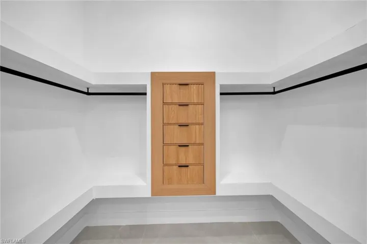 Spacious closet with tile patterned flooring