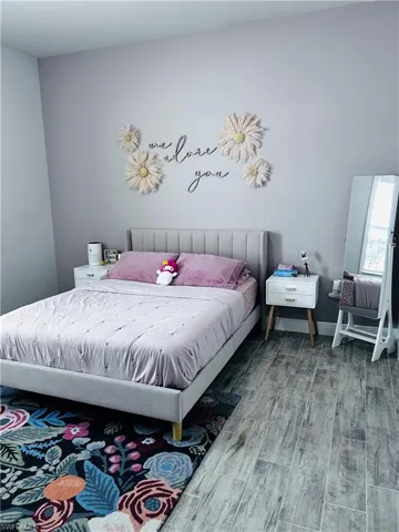 Bedroom featuring wood finished floors