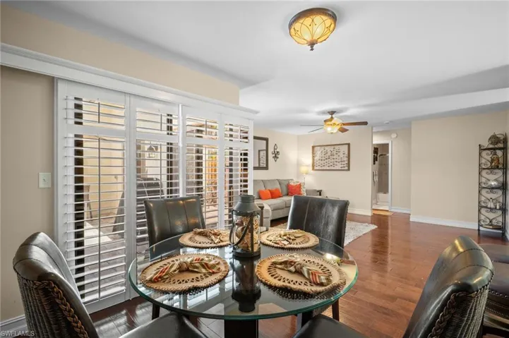 Dining area featuring wood finished floors and ceiling fan