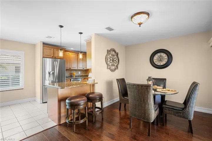 Dining space featuring baseboards and wood finished floors