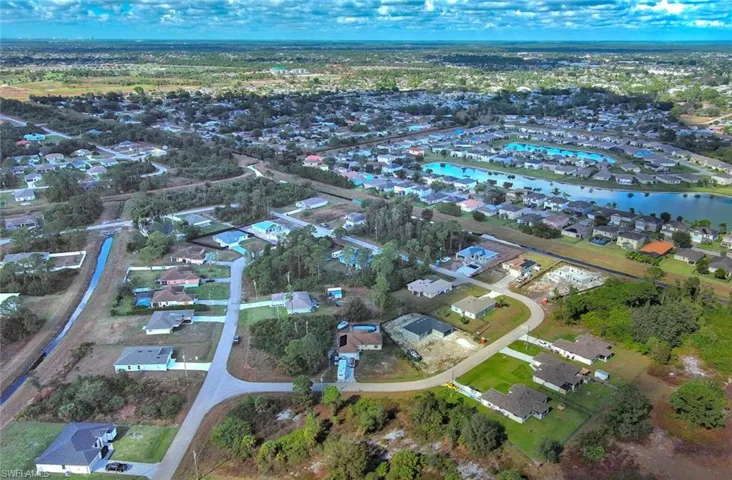 View of property location featuring nearby suburban area and a large body of water