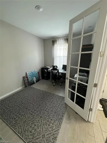 Home office featuring hardwood / wood-style floors