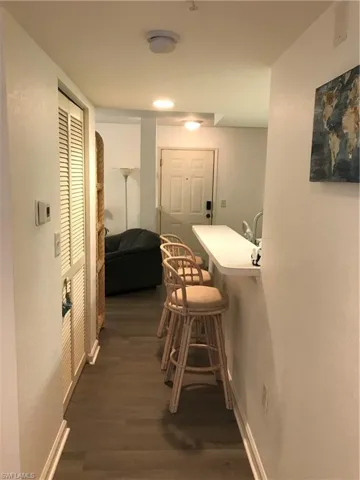 Hallway featuring dark hardwood / wood-style floors