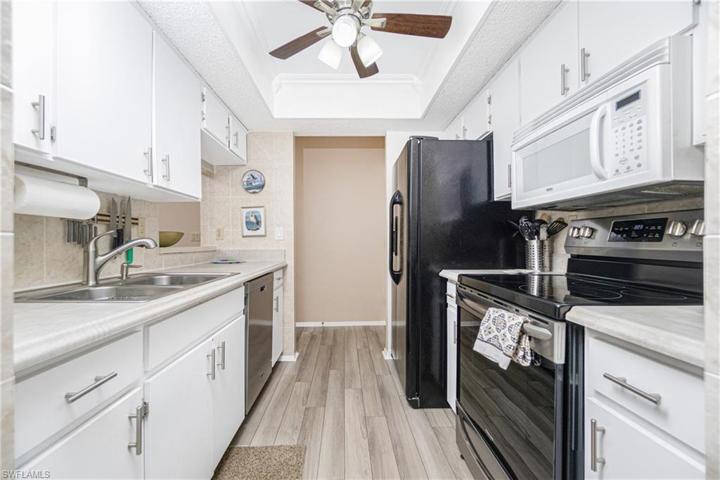 Kitchen was upgraded with new appliances & counter tops in 2019, adding the tray ceiling & fan. Vinyl Flooring continues.