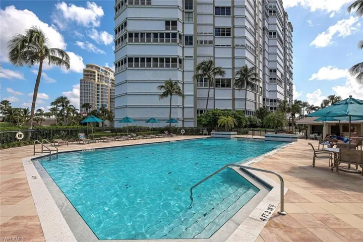 Pool featuring a patio area and fence