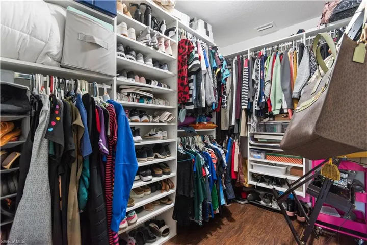 Large walk-in closet with custom shelving