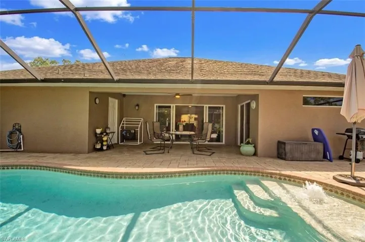 Saltwater pool with half moon pool shelf and water feature