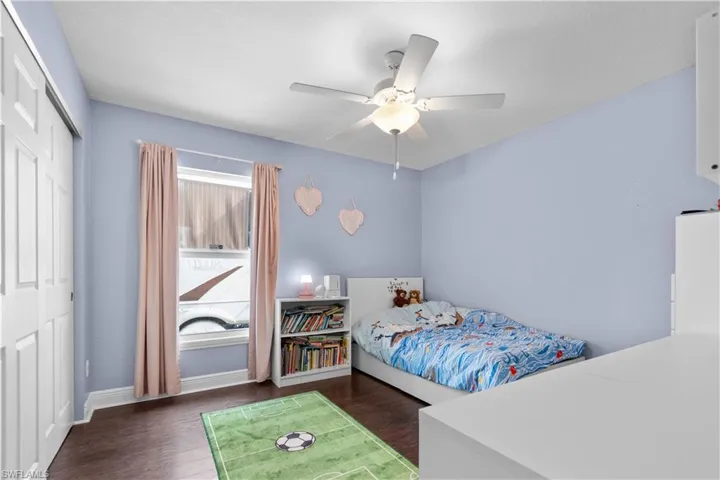 Bedroom #2 features dark hardwood flooring