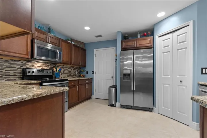Your kitchen features a large pantry and plenty of cabinets and counter space