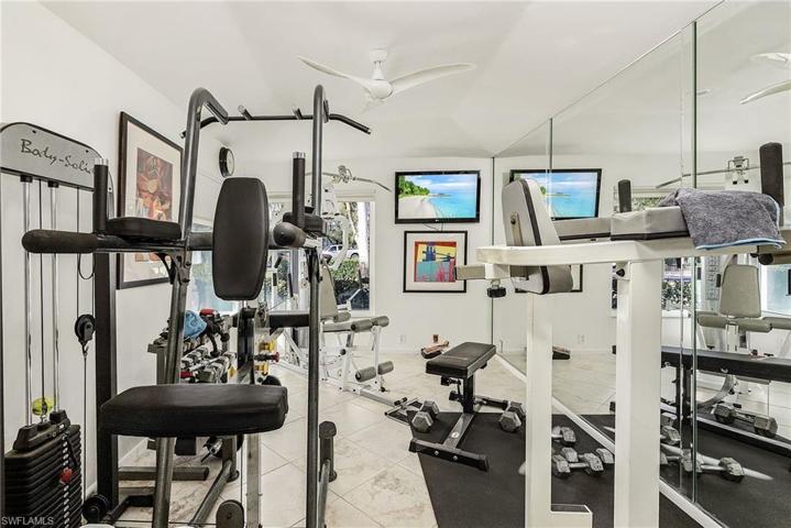 Flex space set up great for an in-home gym, or could be a den or formal dining room.