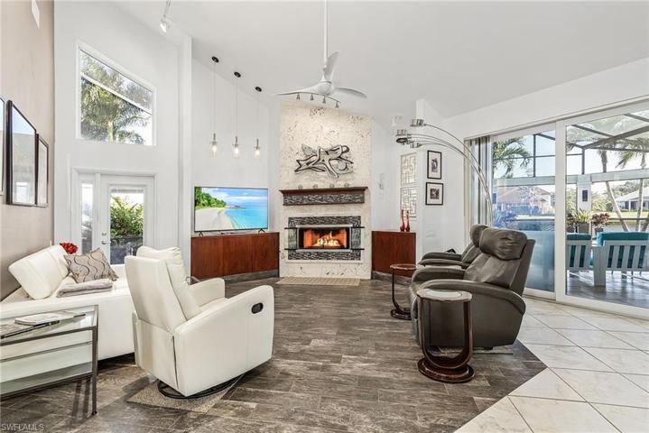 Large, open great room with sliders out to the lanai.