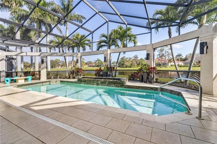Stately palms surround this pool area.