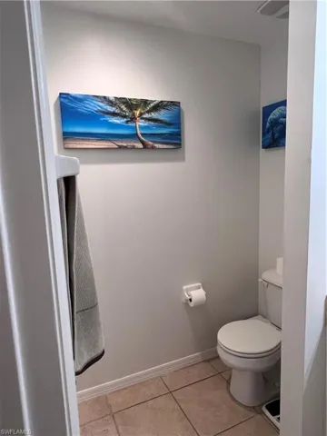 Bathroom featuring tile patterned flooring and toilet