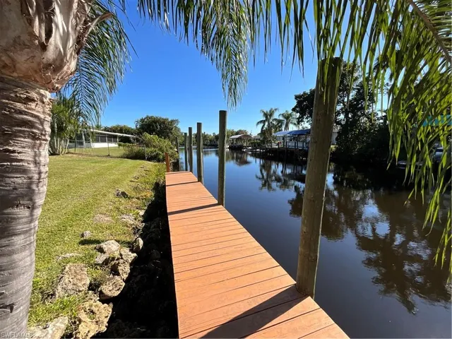 View of dock, deep canal heading to Daughtry’s creek with direct access to the river.