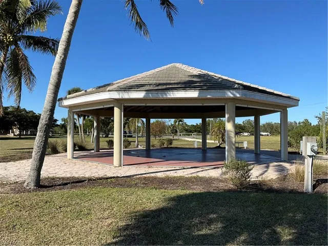 View of home's community with a gazebo and a yard