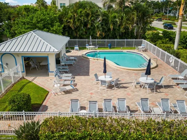 Community pool featuring a patio