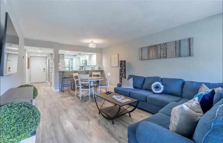 Living area featuring light wood finished floors and baseboards