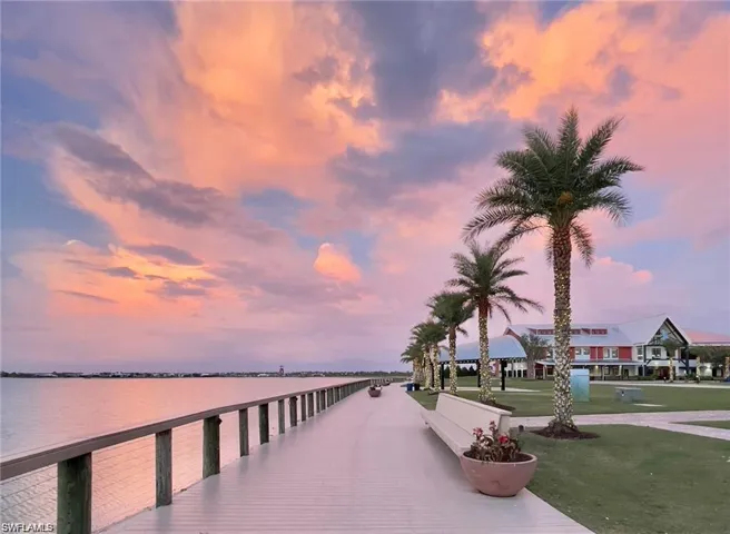 Dock area featuring a yard and a water view