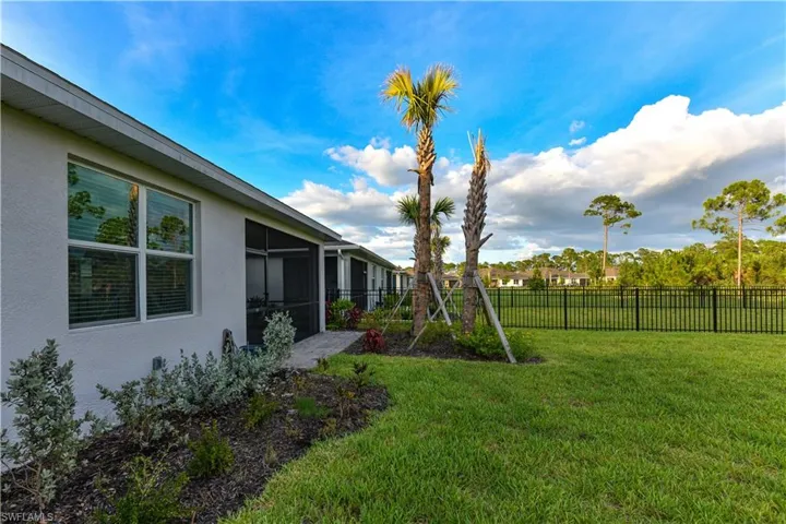 View of yard with a sunroom