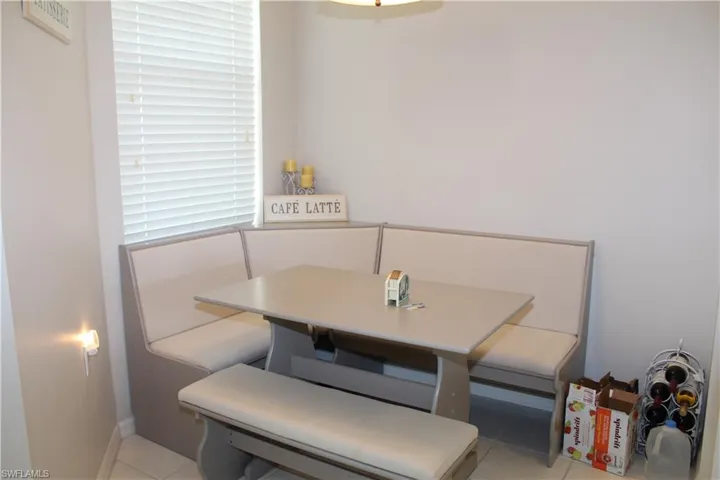 Dining area featuring light tile patterned flooring