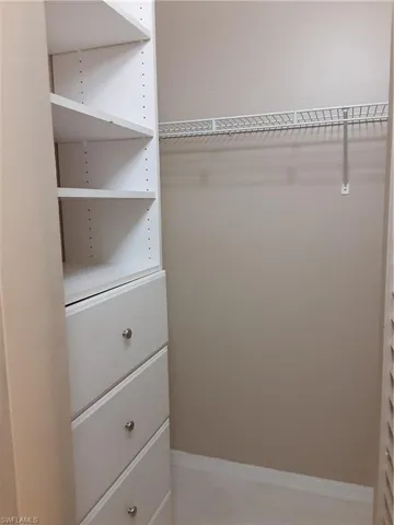 Spacious closet featuring light tile patterned floors
