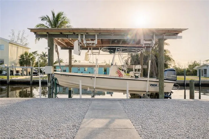 Dock area with boat lift and a water view