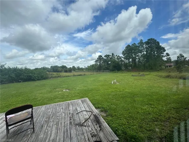 View of grassy yard with a view of rural / pastoral area
