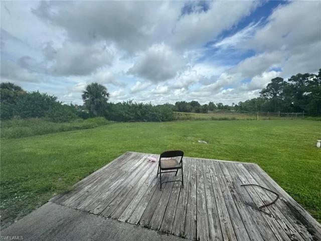 Deck featuring a yard and a view of rural / pastoral area