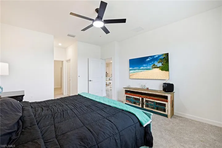 Bedroom featuring carpet and ceiling fan