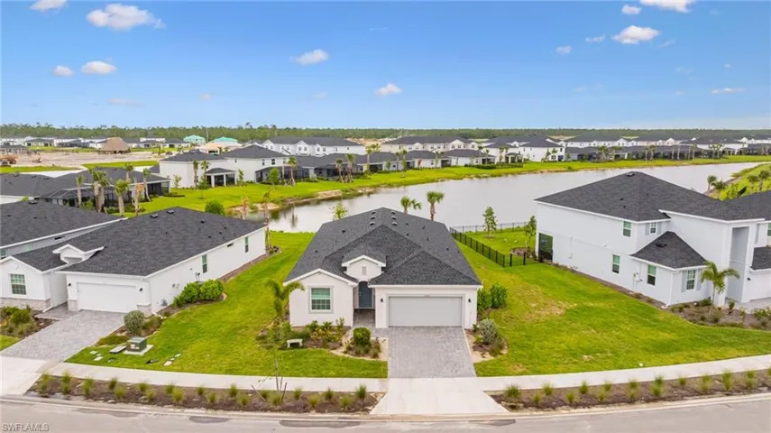 Aerial perspective of suburban area with a large body of water