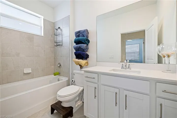 Bathroom featuring vanity and bathing tub / shower combination