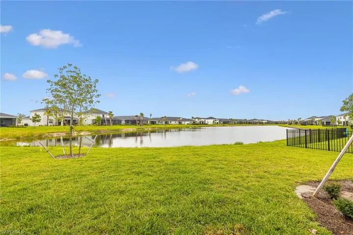 View of yard featuring a residential view and a water view