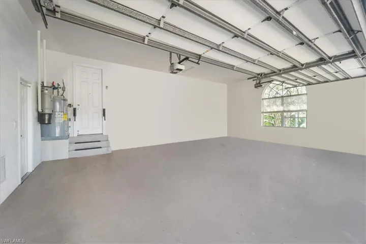 Garage with a garage door opener and water heater