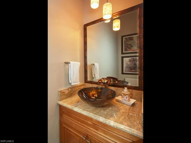 Powder room, located between great room and primary bedroom.