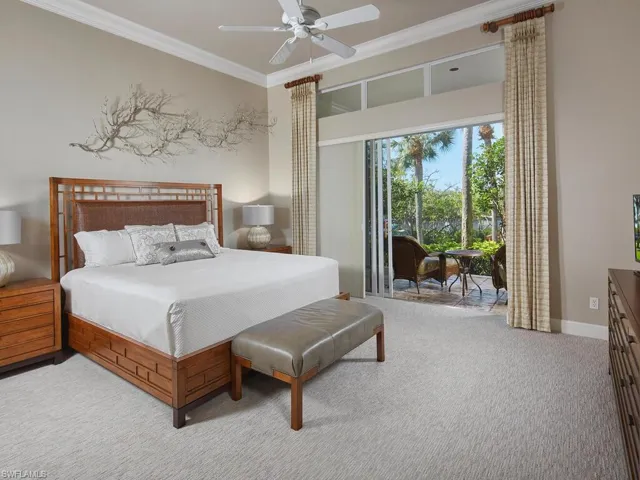 Spacious primary bedroom with en suite. Doors open onto the lanai.