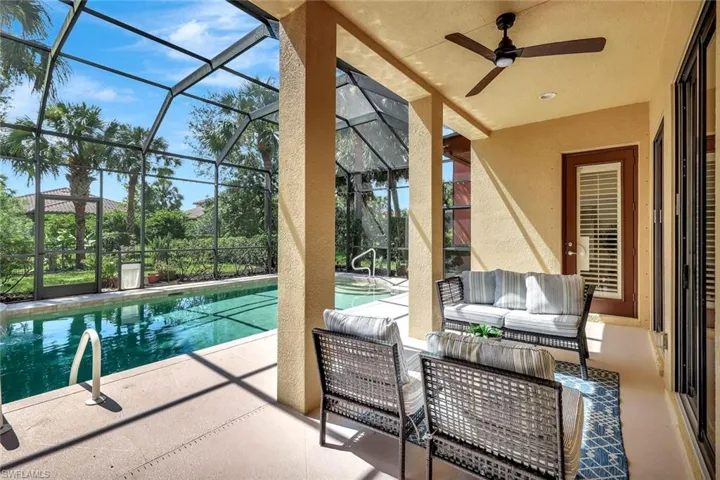 Swimming pool with a patio area, an outdoor living space, a lanai, and ceiling fan