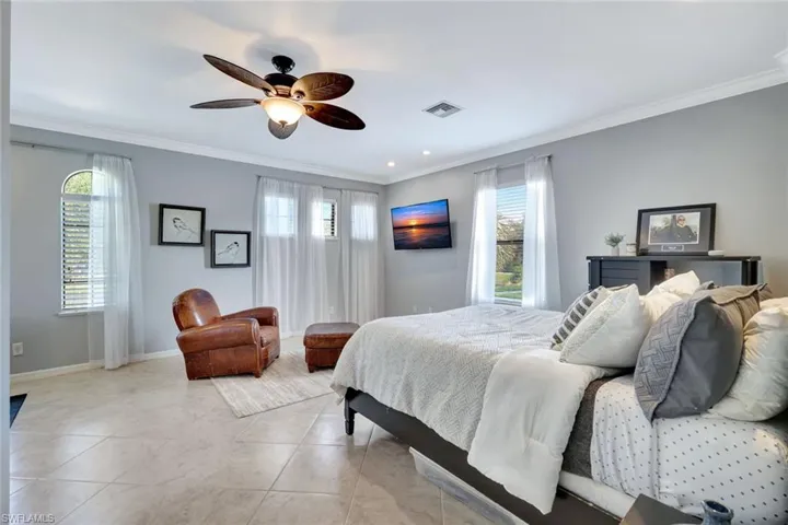 Bedroom featuring ornamental molding, recessed lighting, and ceiling fan