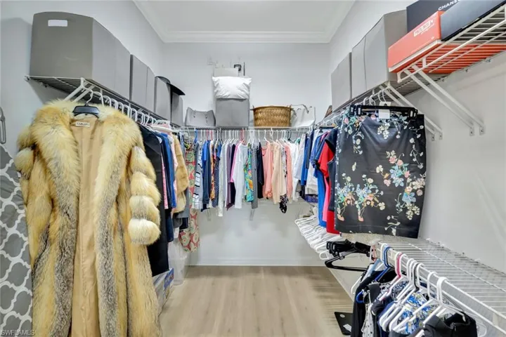 Spacious closet featuring wood finished floors