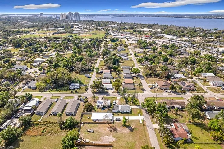 Aerial view with a water view and a residential view