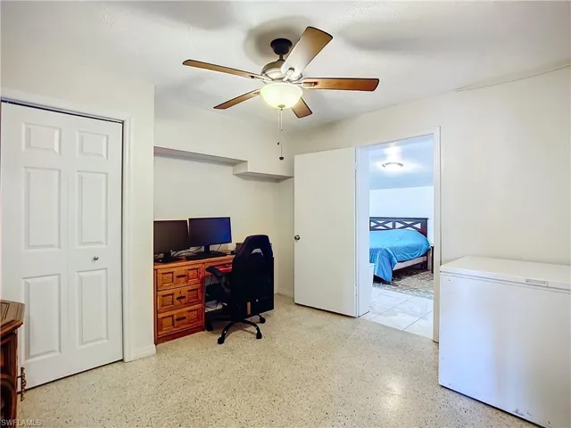 Home office featuring a ceiling fan