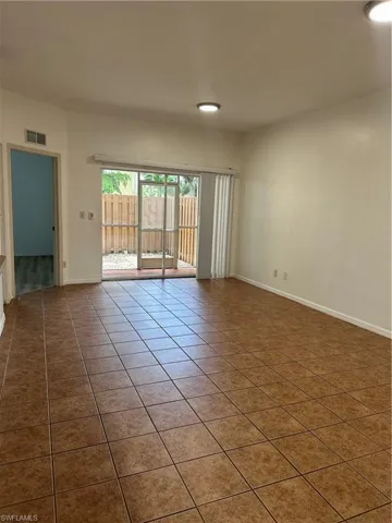 Spare room featuring tile patterned flooring