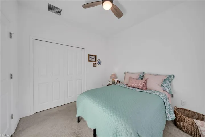 Bedroom 3 with carpet, a closet, and ceiling fan
