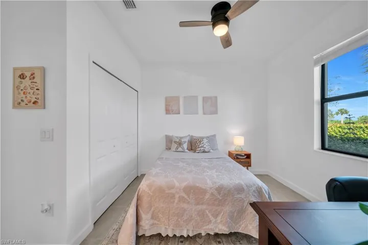 Bedroom 2 - suite featuring ceiling fan and a closet